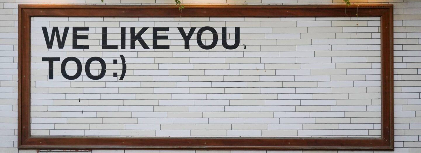 Image of a sign that says We Like You Too